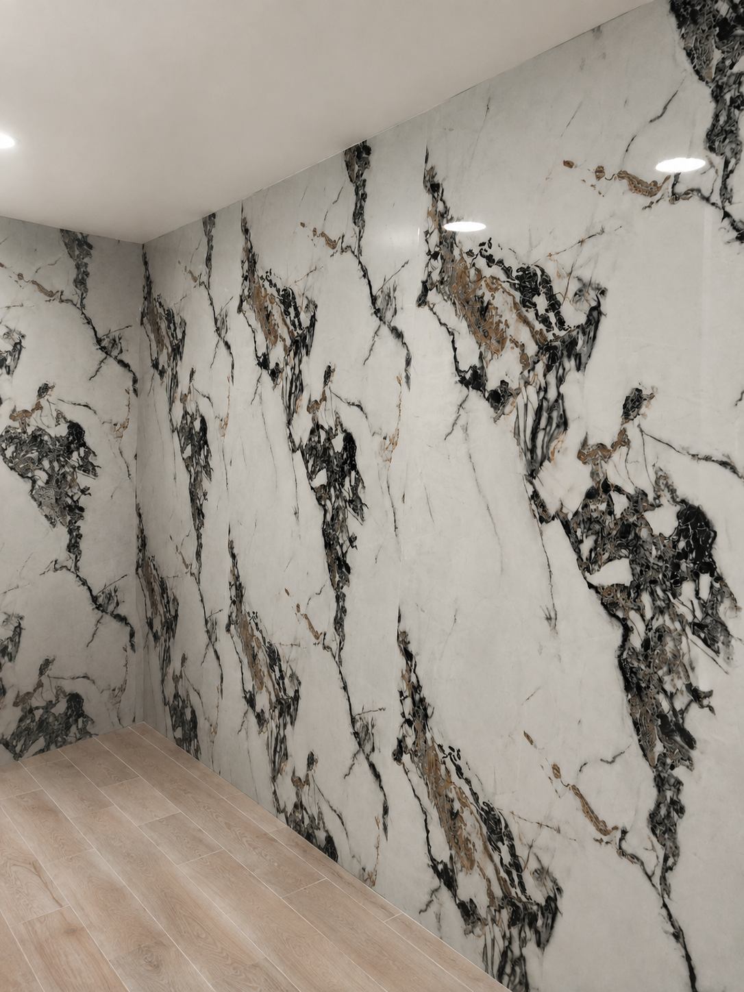 Estancia revestida con porcelánico de gran formato efecto mármol y suelo efecto madera